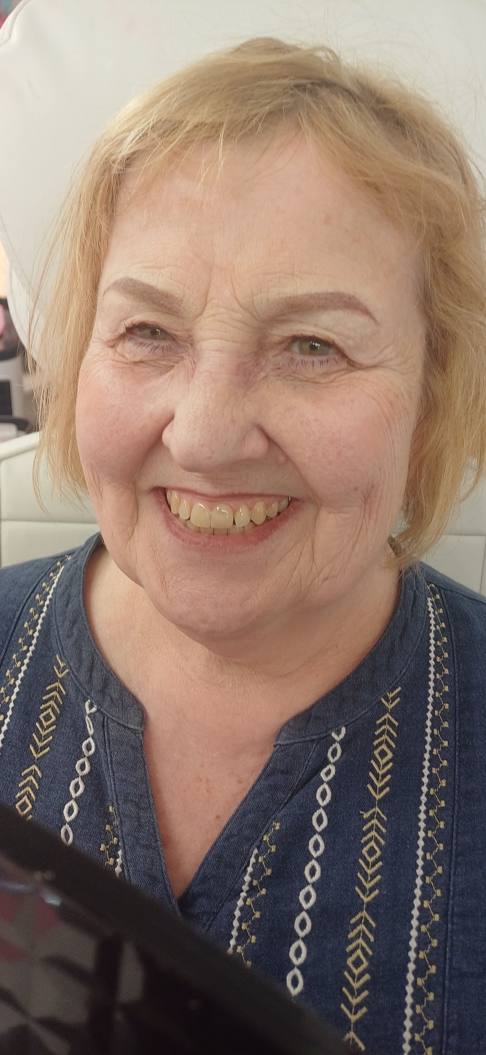 A smiling client at the Otley studio